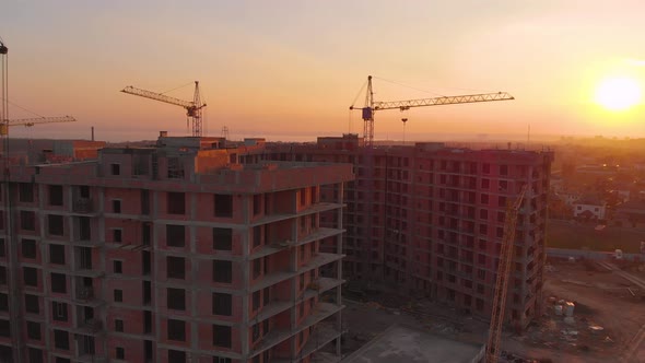 Construction Site in the Middle of the City and Private Houses at Sunset in .