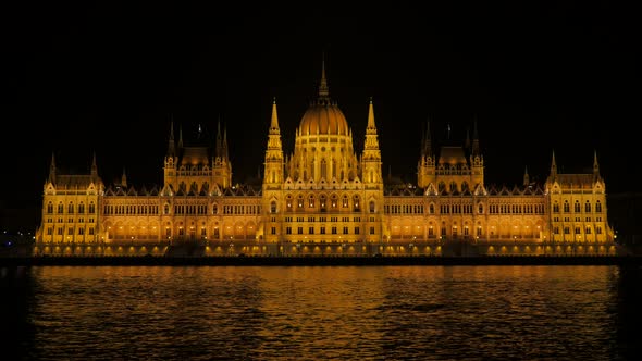 Beautiful parliament  building in Budapest night scene with reflection on Danube river 4K 2160p 30fp