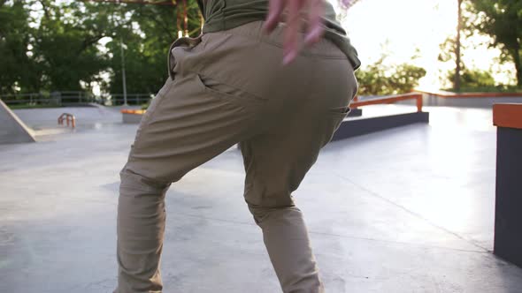 Skateboarder Doing a Tricks in a Concrete Skate Park Close Up Slow Motion