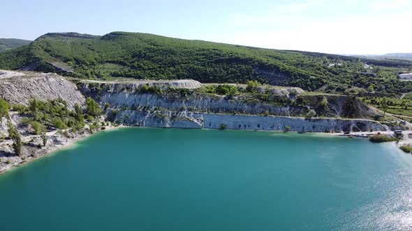 Drone footage of lake with hills