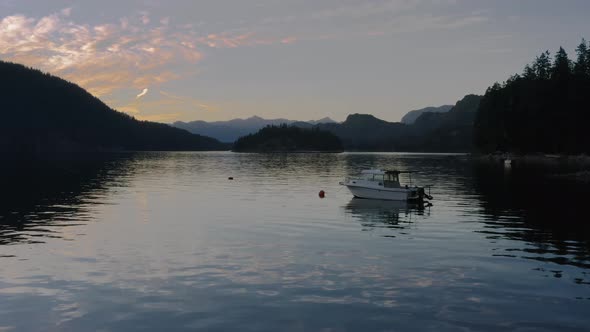 Lone Boat Mooring By The Calm Water With Beautiful Sunset Views Of Sechelt Inlet - A Pacific Ocean F