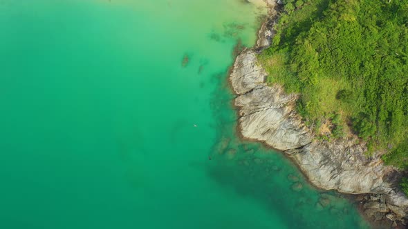 Aerial High angle view of people enjoy swimming and relax on the beach in Phuket Thailand Patong bea