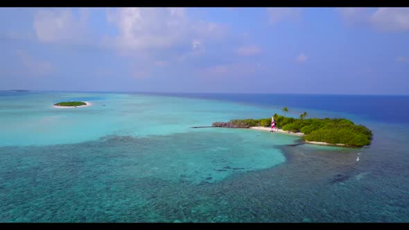 Aerial top down texture of tranquil island beach lifestyle by blue ocean with white sand background 