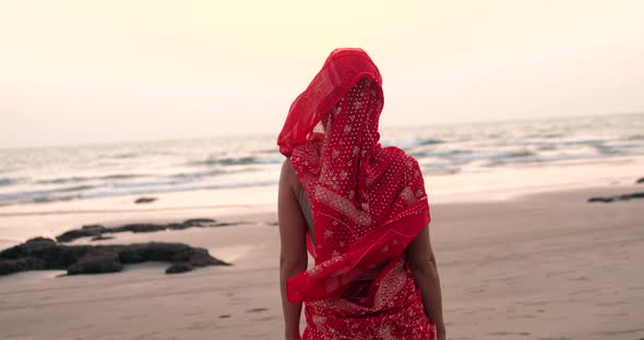 Young Women Wearing a Red Saree on the Beach Goa India