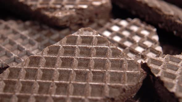 Waffle brown chocolate cookie texture. Wafer crispy surface. Waffled pattern. Macro