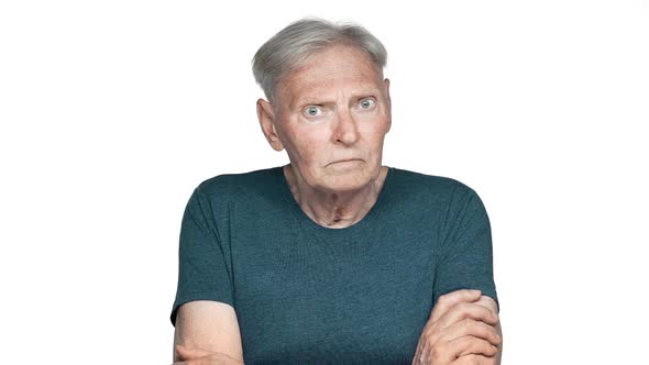 Portrait of Bored Grandfather 80s Having Gray Hair in Basic Tshirt Rolling His Eyes and Expressing
