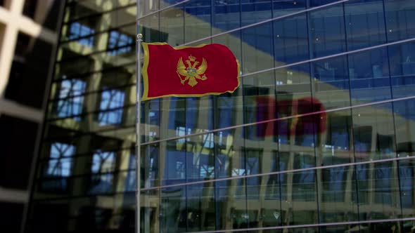 Montenegro Flag Waving On A Skyscraper Building