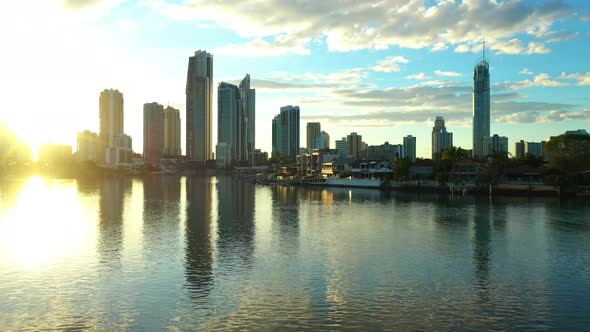 Desent over main canal, golden sunrise at Surfers Paradise and the Q- one building