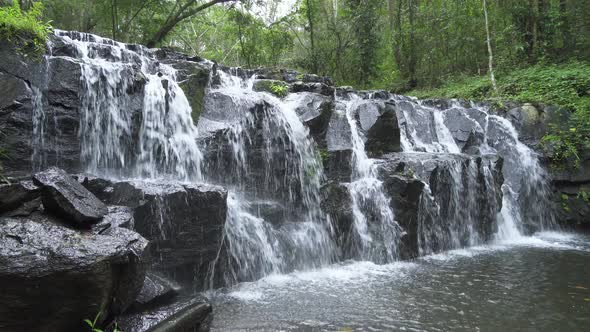 Beautiful waterfall cliff in tropical forest at Namtok Samlan National Park, Saraburi, Thailand