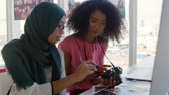 Young women working in a creative office