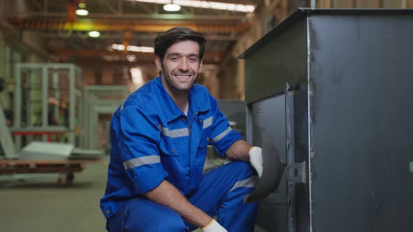 Portrait of Caucasian man industry worker working in factory warehouse.