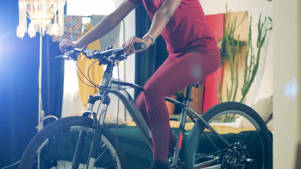 African Lady Is Riding a Mechanical Bicycle in Selfquarantine