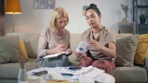 Women Analyzing Finances At Home