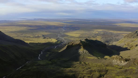 Drone Over Vast Green Landscape With Braided River