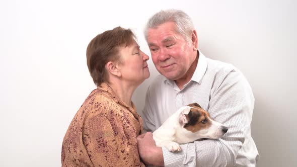 An Elderly Couple with a Dog on a White Background