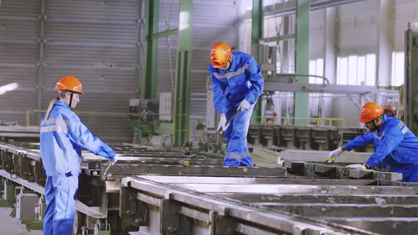 Factory workers at constructive manufacture