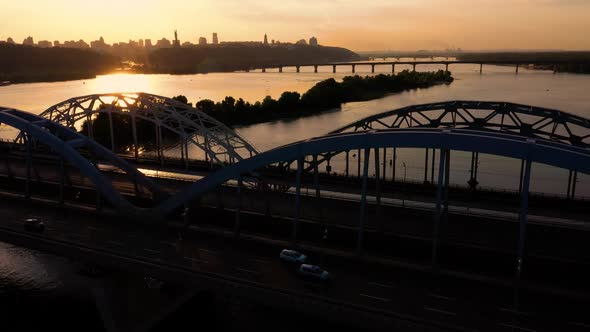 Aerial Top View of the Bridge and River During Sunset