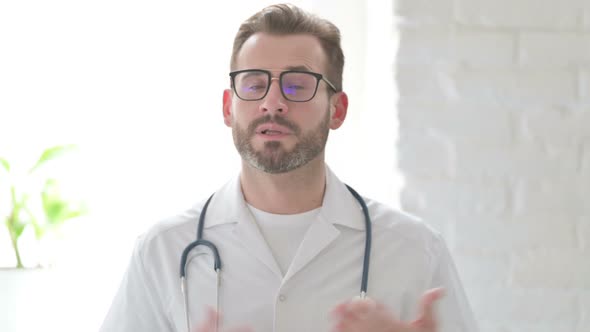 Portrait of Doctor Talking on Online Video Call