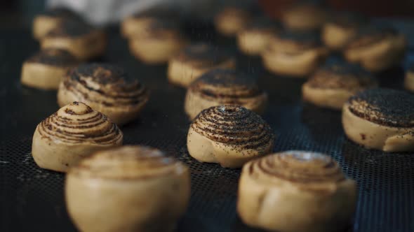 Woman making cinnabon in the kitchen