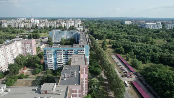 Aerial View MultiStorey Buildings Near Green Forest in Residential Area at City