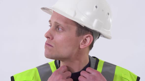 Portrait of Self Confident Handsome Man in Construction Cloth and Hat