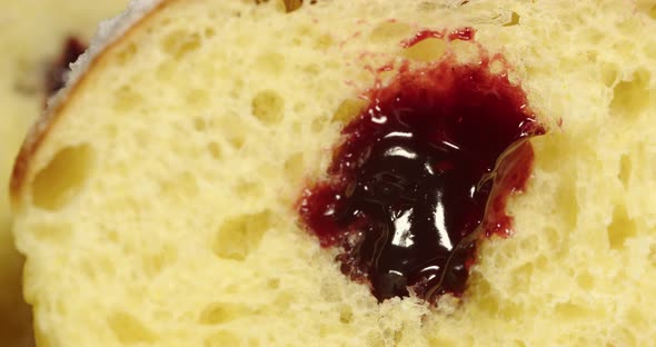 Donut With Jam Sprinkled With Powdered Sugar