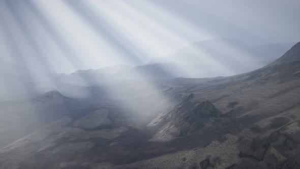 Sun Rays Against the Backdrop of the Mountains alt