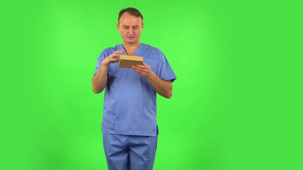 Medical Man Gives a Gift and Gets Upset. Green Screen