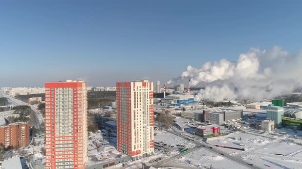 Two modern orange high-rise buildings and industrial zone with a lot of smoke 02