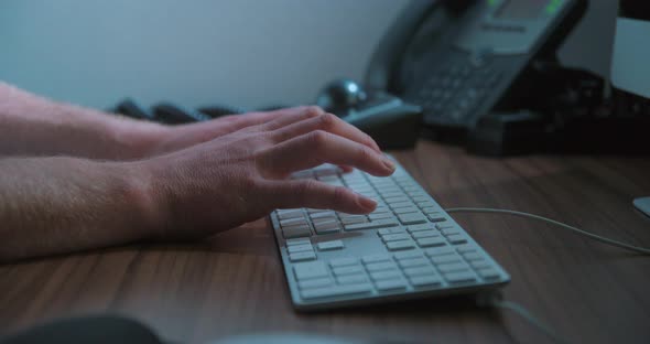 Typing keyboard man remote working, close-up slow motion, studio shot in 4K prores HQ