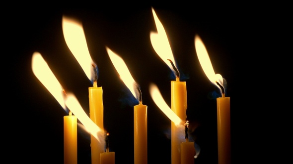 Group Of Candles Blow Out In The Dark