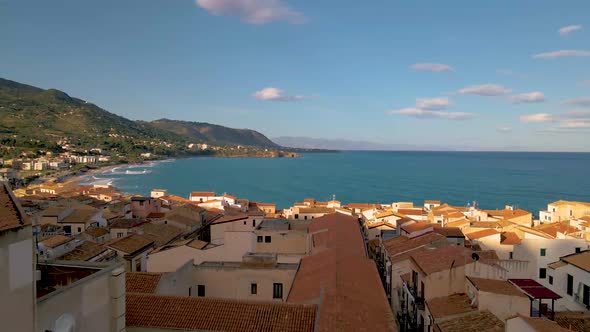 Cefalu Sicily Sunset at the Beach of Cefalu Sicilia Italy Mid Age Men and Woman on Vacation Sicily