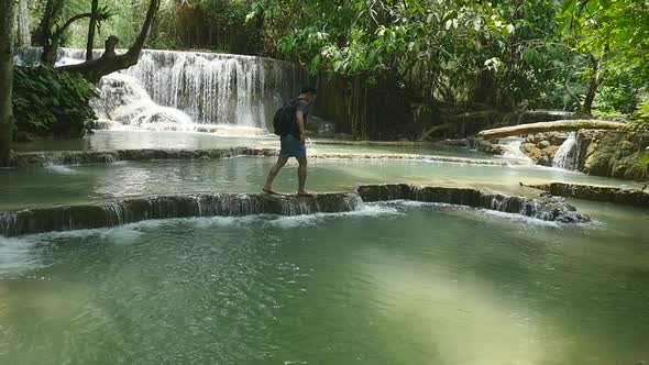 Man Hiking In Beautiful Waterfall