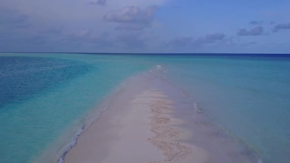 Aerial drone landscape of shore beach by clear sea with sand background