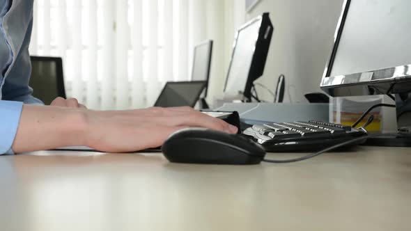 Young Man Working on Tablet in the Office - Closeup on Hands