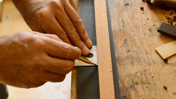 Luthier Pointing the Frets of a Guitar