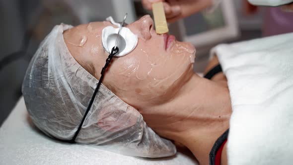 Beautician Prepares Laser Rejuvenation Facial Hair Removal Woman in Beauty Salon