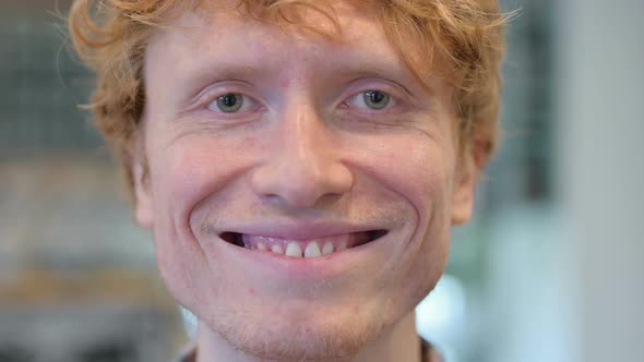 Close Up of Face Young Redhead Man Smiling at the Camera