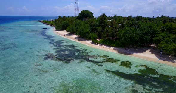 Natural drone tourism shot of a white sandy paradise beach and aqua blue water background in high re