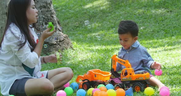 Little Boy Playing with Mother alt