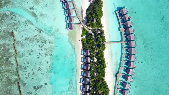 Aerial view sky of tropical shore beach by blue lagoon with sand background