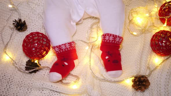 Baby Feet In Funny Christmas Socks