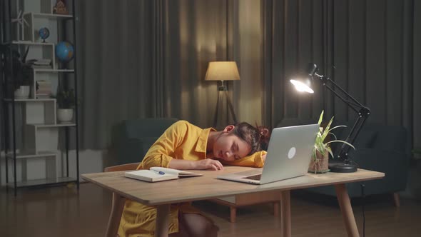 Asia Businesswoman Sleeping While Working From Home At Living Room At Night