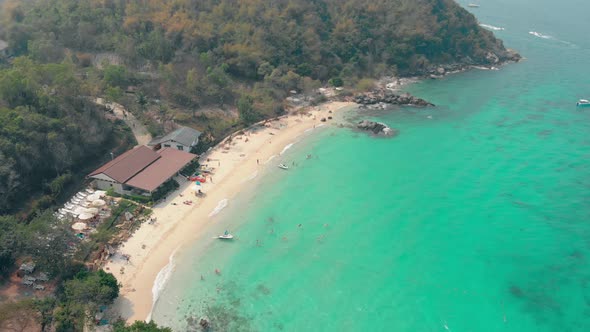 Tourist Paradise Beach with Buildings Near Turquoise Ocean