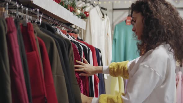 Young Girl Shopping in a Clothing Store