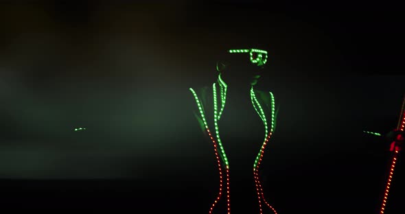 Portrait of a Man in Glowing Costume and Glasses Dancing in the Dark, 