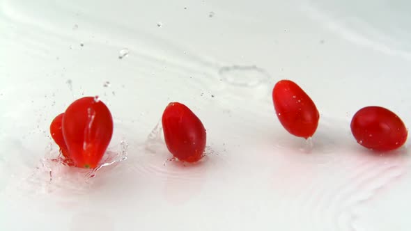 Slo-motion cherry tomatoes falling