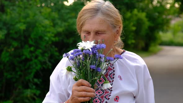 Old Ukrainian Woman with Flowers