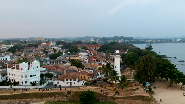 Aerial drone of Galle fort Lighthouse at sunset golden hour. Galle Dutch Fort, Sri lanka