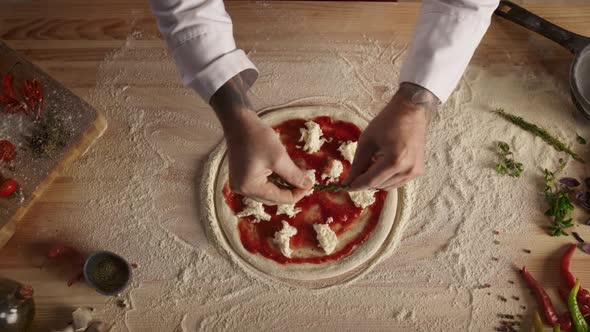 Professional Chef Prepare Pizza Dough on Table